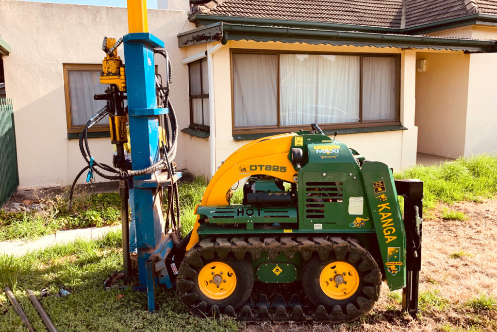 Drilling to determine soil for a new build.